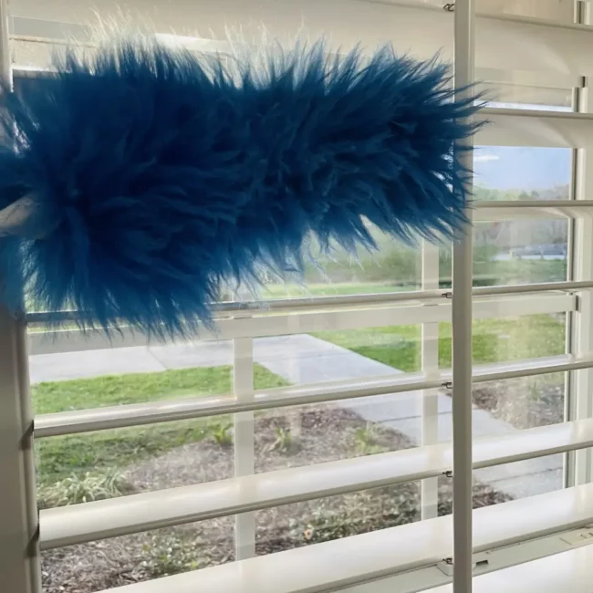 dusting blinds with a flue duster