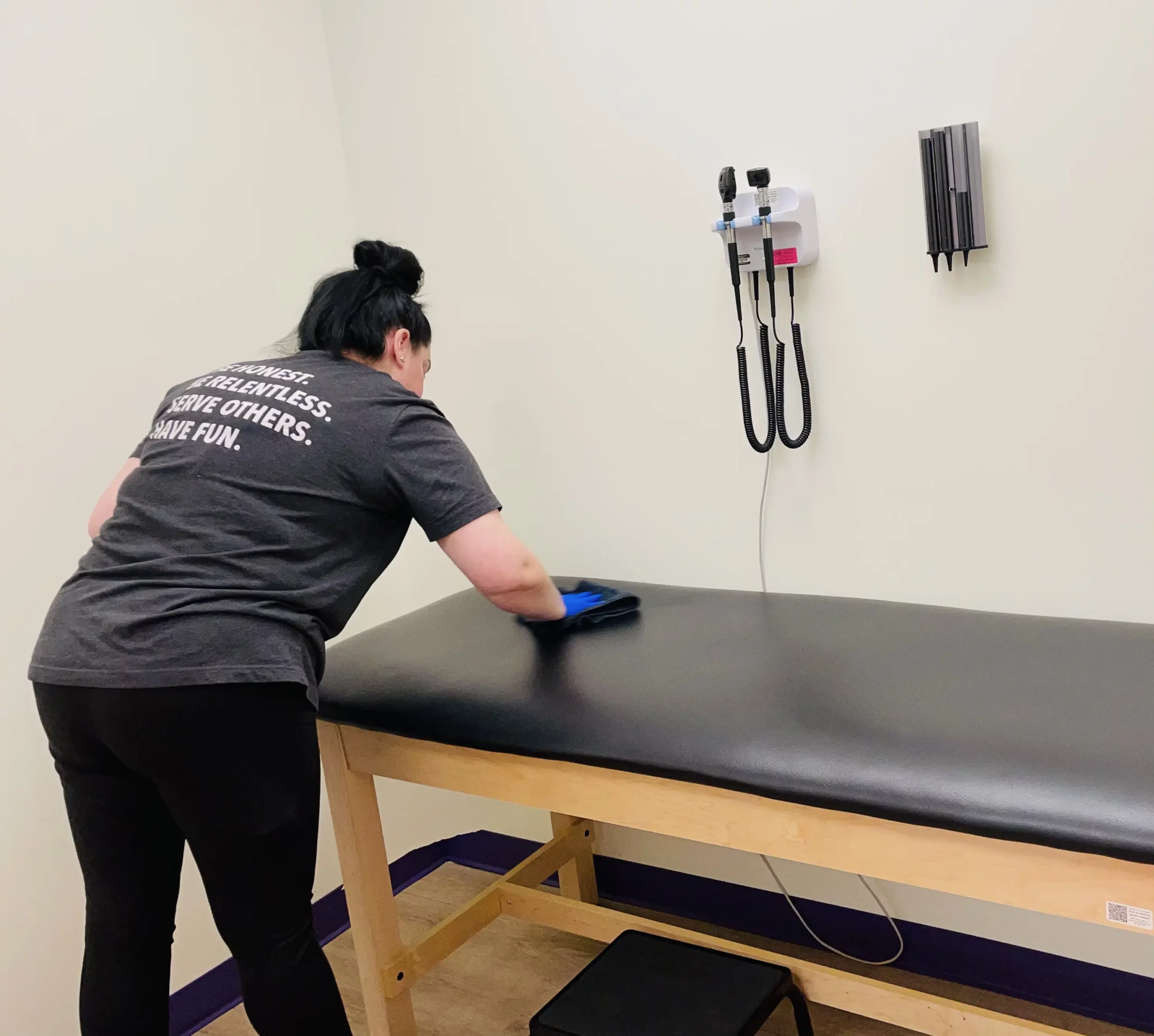 Premier Cleaning & Janitorial Medical Facility Cleaning Services - disinfecting medical exam room bed